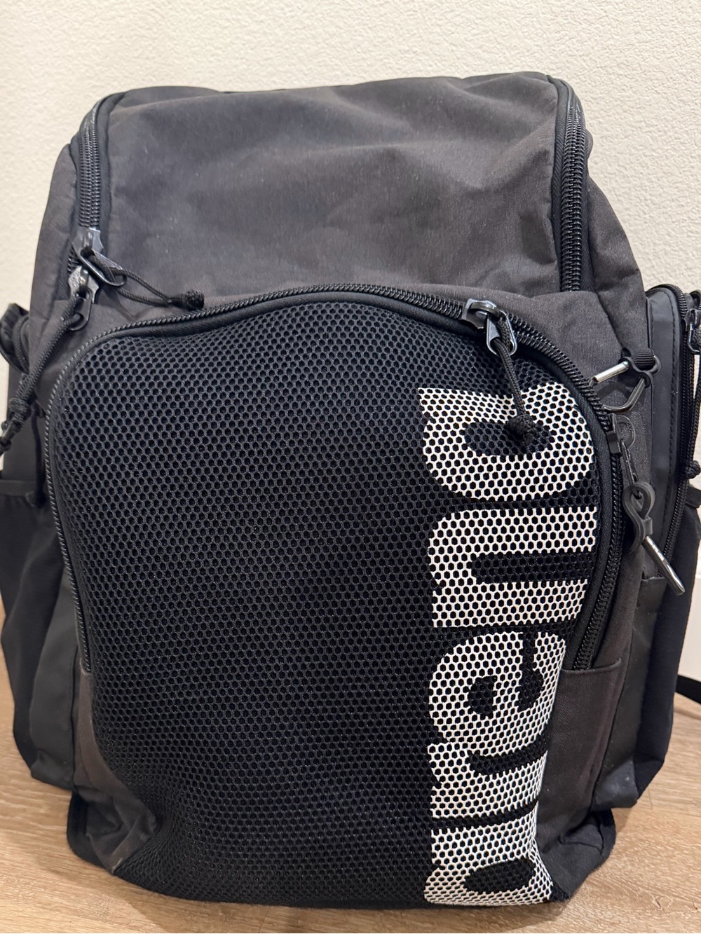 Arena black swim backpack with white arena text on mesh panel #arena #backpack